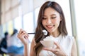 Woman eat rice in restaurant