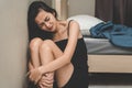 Asian young woman feeling depressed and sad in the room Royalty Free Stock Photo