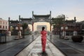 Asian young woman in old traditional Chinese dresses in Hutong village in Beijing, China