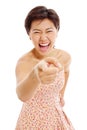 Asian young woman pointing out and laughing