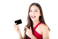 Asian young woman with red dress holding a credit card and smiling. Royalty Free Stock Photo