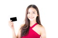 Asian young woman with red dress holding a credit card thinking to spend money lots isolated Royalty Free Stock Photo