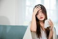 Asian young woman she sick blowing nose sneezing in tissue at home Royalty Free Stock Photo