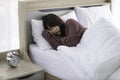 Asian young woman is sick and sleep in the bedroom. A girl hangover from a party last night and she is having a nightmare