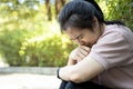 Asian young woman sitting alone in outdoor at park, broken heart despair, suffer depression problem, feeling sad,cry,disappointed Royalty Free Stock Photo