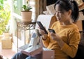 asian young woman sitting received online shopping canvas shoes parcel opening boxes Royalty Free Stock Photo