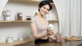 Asian young woman in sportswear drinking milk in kitchen at home , healthy lifestyle concept Royalty Free Stock Photo