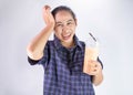 Asian young woman touching head with hand because she Brain freeze from drinking cold water. Health care concept Royalty Free Stock Photo