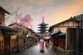 Asian young woman traveller wearing japanese traditional kimono with red umbrella sightseeing at famous destination Sannen Zaka Royalty Free Stock Photo