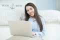 Asian young woman using laptop computer in her bedroom. Royalty Free Stock Photo