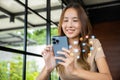 woman using smart phone for shopping online at cafe coffee shop in the morning Royalty Free Stock Photo