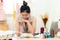 Asian young women fashion designer  working on her designer in the showroom,  Lifestyle Stylish tailor taking measurements on mann Royalty Free Stock Photo