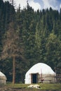 Asian yurt in the middle of the forest in the mountains Royalty Free Stock Photo