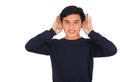 An Asianman in black shirt is covering his ears with his hands. Royalty Free Stock Photo