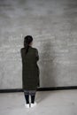 Female college students stand in front of the blackboard writing Royalty Free Stock Photo