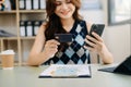 businesswoman hand using smart phone, tablet payments and holding credit card online shopping, omni channel, digital tablet