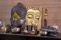Asiatic decoration in brown and gold with buddha and candles at