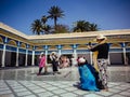 Asiatic tourists doing photos in the Marrakech palace in Morocco.