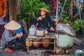 Asiatic woman take her lunch in an asiatic market.