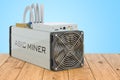 ASIC miner on the wooden planks, 3D rendering