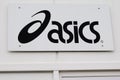 Asics logo and sign of Japanese multinational corporation shoes athletic equipment Royalty Free Stock Photo