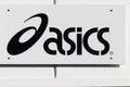 Asics logo on a wall Royalty Free Stock Photo
