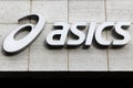 Asics logo on a wall