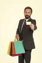 Ask deliver your purchases. Businessman formal suit holds bunch paper bags while show business card. Man bearded