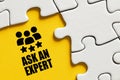 Ask an expert message surrounded by puzzle pieces. Professional consulting, advice or support Royalty Free Stock Photo