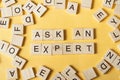 Ask an EXPERT text on wooden cubes. Wood abc. Royalty Free Stock Photo