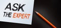 Ask the Expert Text written on notebook page, red pencil on the right. Motivational Concept image Royalty Free Stock Photo