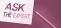 Ask the Expert Text written on notebook page, red pencil on the right. Motivational Concept image Royalty Free Stock Photo