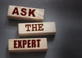 Ask the Expert words on wooden blocks. Consulting a professional, master or consultant for a solution and advice Royalty Free Stock Photo