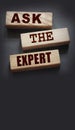 Ask the Expert words on wooden blocks. Consulting a professional, master or consultant for a solution and advice Royalty Free Stock Photo