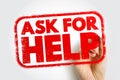 ASK FOR HELP stamp held by a hand, encouraging support-seeking and collaboration in a bold textured style, ideal for teamwork, Royalty Free Stock Photo