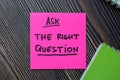 Ask The Right Question write on sticky notes isolated on office desk