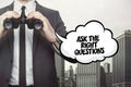 Ask the right questions text on blackboard with businessman Royalty Free Stock Photo