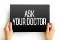 ASK YOUR DOCTOR text on card, medical concept background