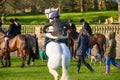 Young children sat on horses in an English countryside setting, waiting for the fox hunt to begin Royalty Free Stock Photo