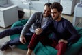 Asking for professional advice. Two young businessmen in smart casual wear talking and gesturing while leaning at the Royalty Free Stock Photo