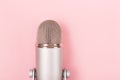 Professional microphone on pink background. Minimal compostion. Royalty Free Stock Photo