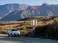 Car driving along the scenic road in Aso volcanic caldera, part of Aso-Kuju National Park