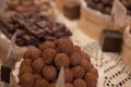 Asorted chocolate truffles and pralines. Chocolate and coconut candies on the counter in the confectionery store