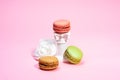 Asorted Macarons on a pink background