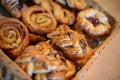 Asorted pastry in basket at breakfast serving. Selective focus