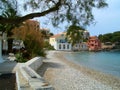 small rocky beach cove and houses