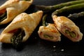 Asparagus baked in puff pastry with ham and cheese. Royalty Free Stock Photo