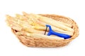 Asparagus in a basket with vegetable peelers Royalty Free Stock Photo