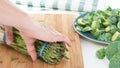 Asparagus, broccoli and Brussels sprouts on a wooden cutting board Royalty Free Stock Photo