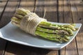 Asparagus bundle on a wooden background Royalty Free Stock Photo